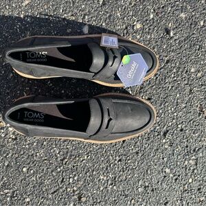 TOMS Black Leather Slip-Ons